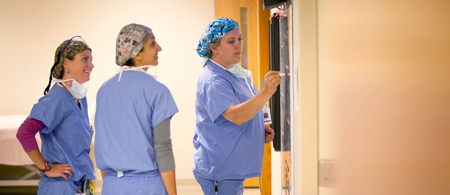 Surgery specialists preparing a list of surgical services for upcoming surgery in the WDH surgical care Center.